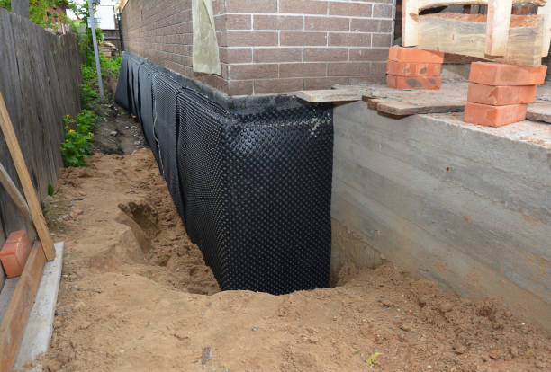 Happy homeowners after waterproofing job in Newark